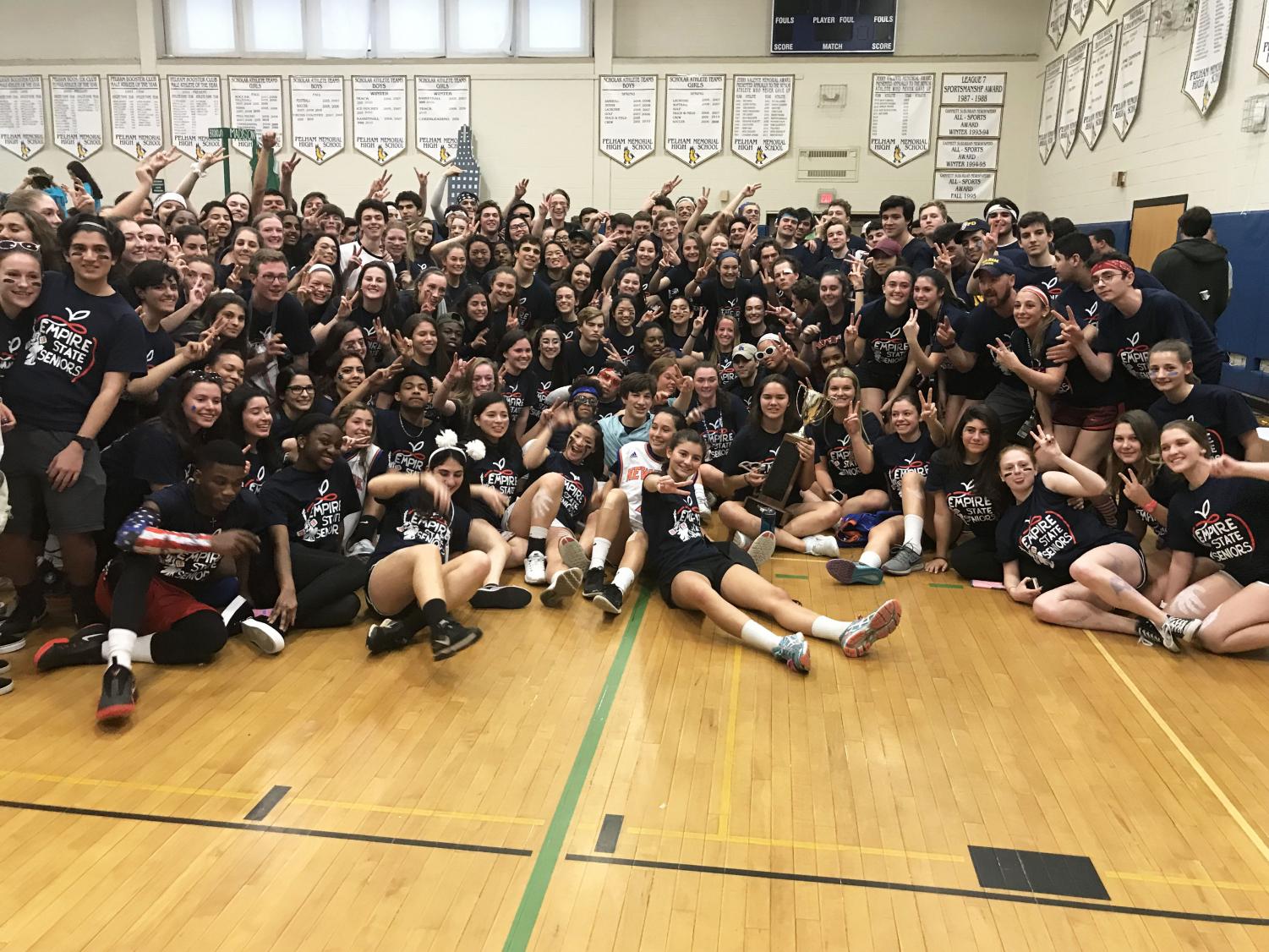 Seniors pose with the winning trophy -- a victory their grade has repeated for two consecutive years.