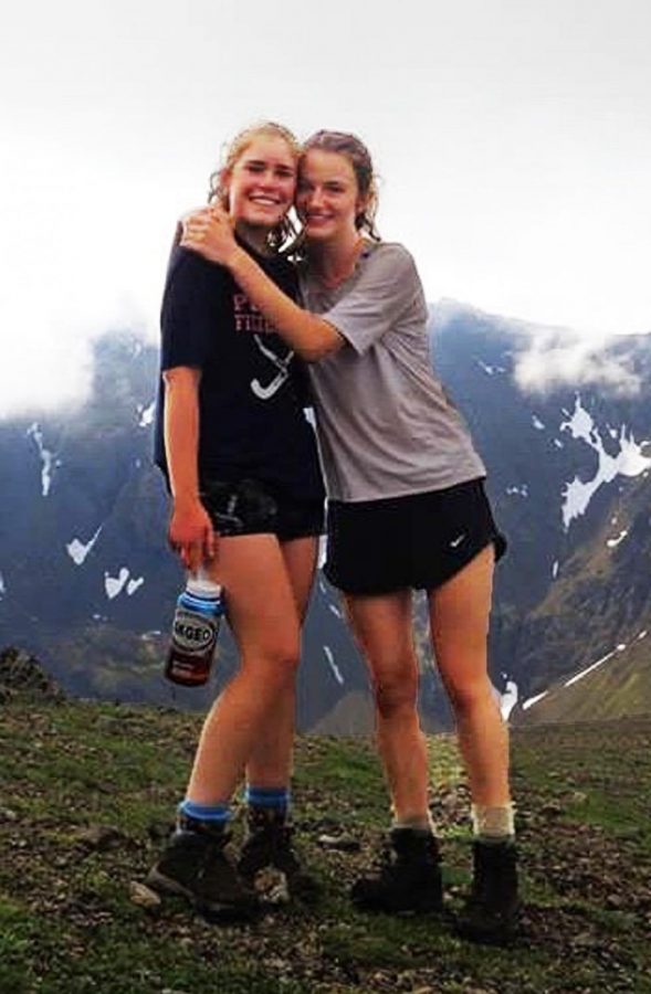 Juniors Lucy Conway and Meredith Kuster relax after an intense hike.