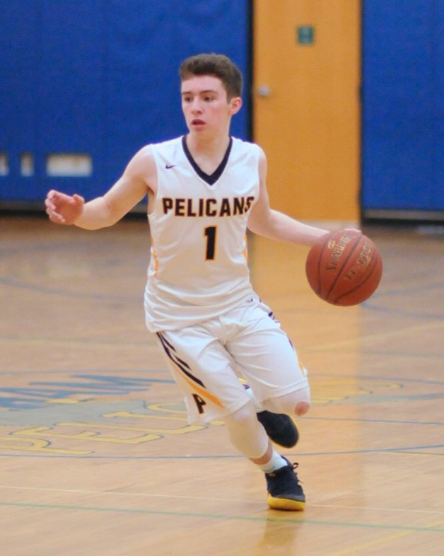 Senior Danny Friedman dribbles on the perimeter 
and looks for an open man.