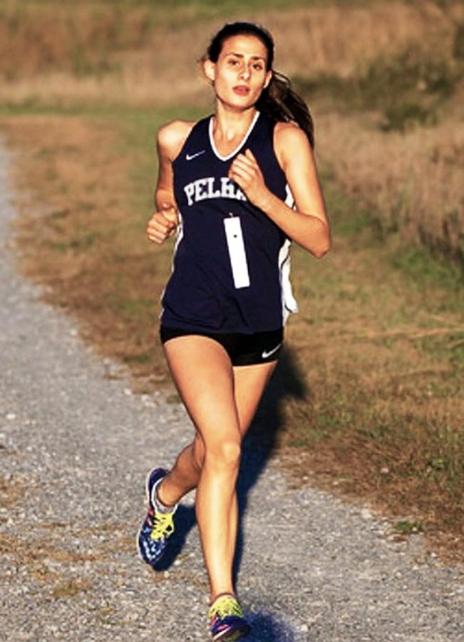 Grace Miske runs towards victory during a race.