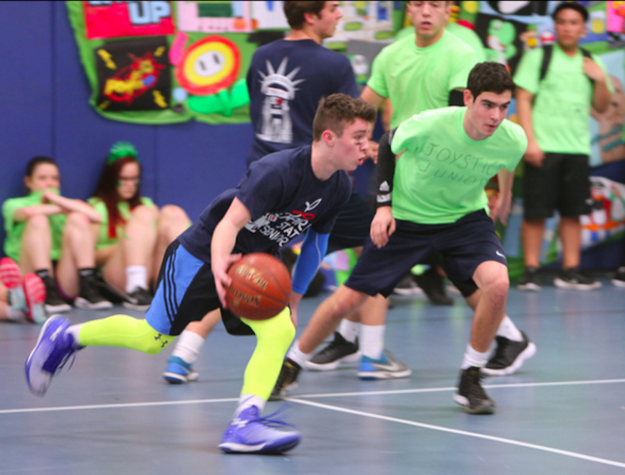 Senior Danny Friedman shows off his basketball skills during Olympics.