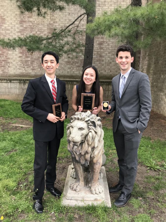 (l to r) Freshmen Isaac Blackburn and Sophia Leung, and junior Henry  Driesen celebrate their success at the NY State Championship.