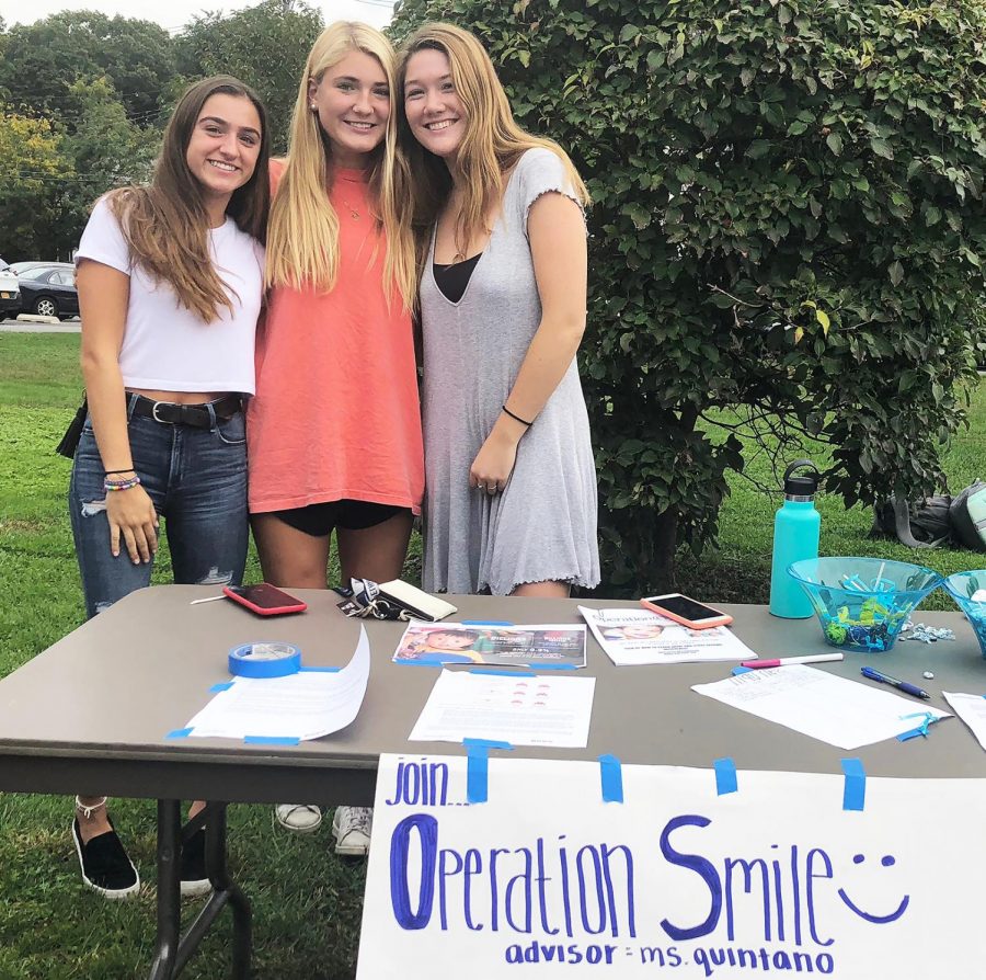 (l to r) Juniors Julianna Cortale, Grayce Cooper, and Ellianna Bryan have plenty to smile about -- a club devoted to making the lives of children a little happier.