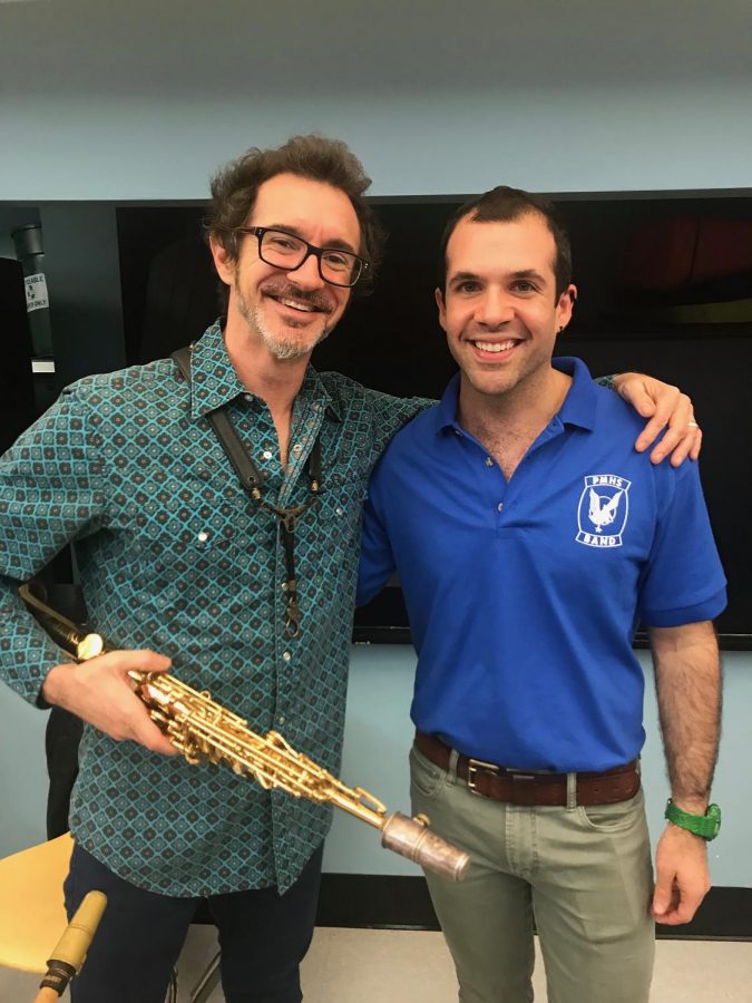 Mr. Van Bochove celebrates with musician Sean Nowell, who works with the jazz band.