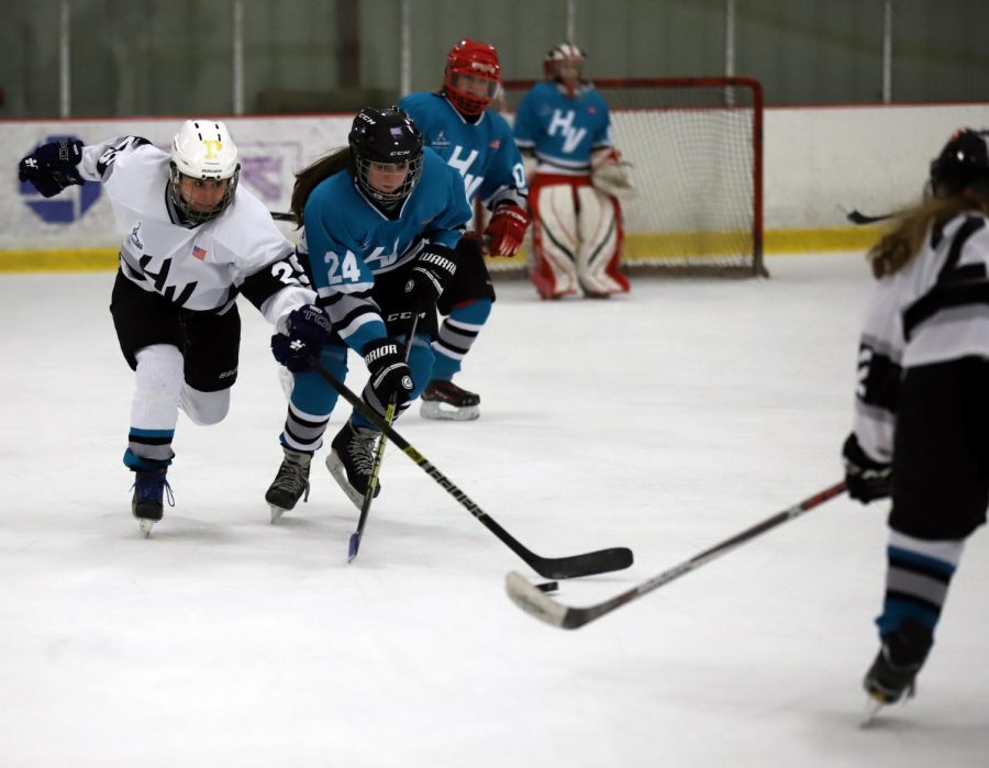 The Westchester girls ice hockey team battles against Rockland.