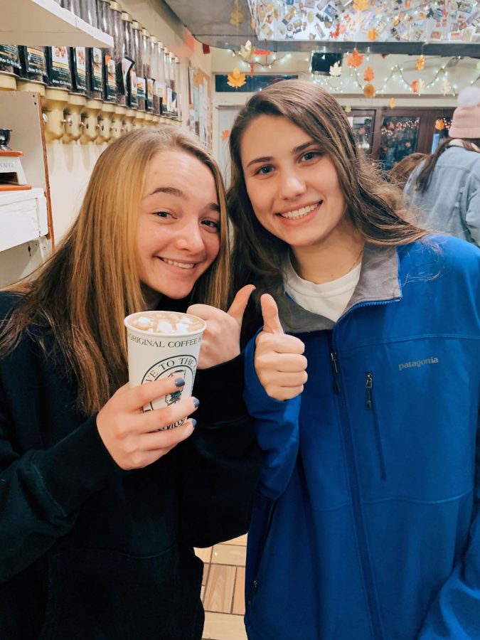 Seniors Sidney Skop and Madelyn Dunbar enjoy a s’mores hot chocolate from Slave to the Grind.