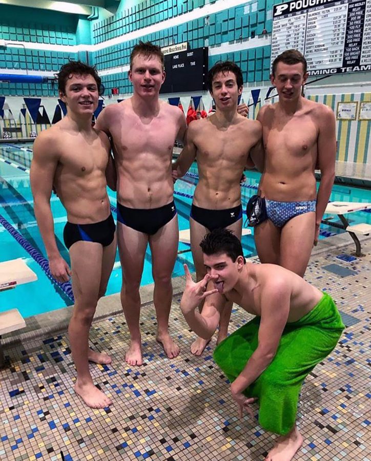 Lance Brady, Peter Fontanella, Chris Hartigan, Dylan Nordstrom, and Matthew Tiso of the boys swim team celebrate poolside after a winning competition.