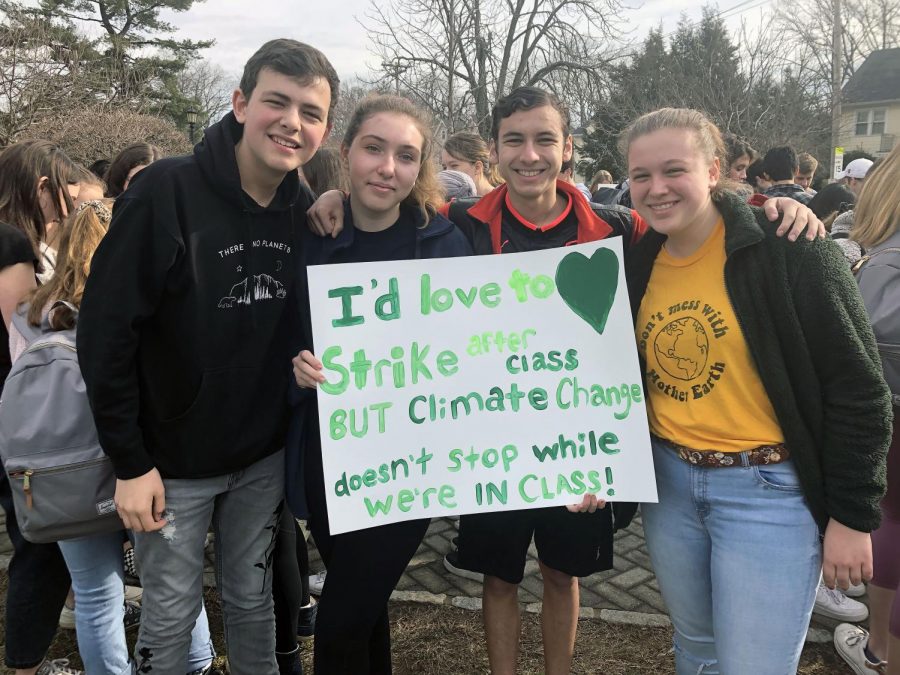 (l to r) Sophomores Nate Bloom, Natalia Cherner, Aiden Levy, and Stevie Gristina 
take to the streets to protest climate change. 