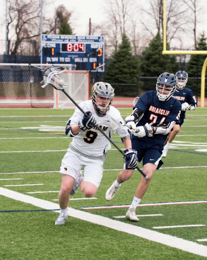 Senior Simon Keough runs up the field in Pelham’s game against Briarcliff