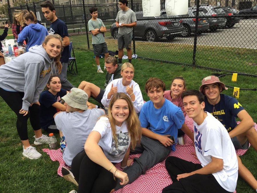 Spikeball participants relax after competing in the tournament.