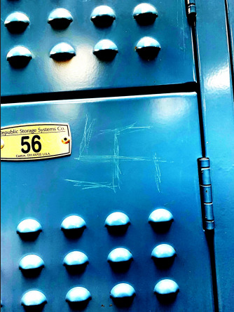 Swastika engraved on locker in the boys locker room.