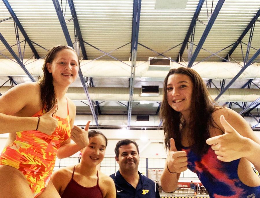 (l to r) Freshmen Julia Gunster and Cindy Wang, Coach Chris Driwinga and junior Asia Bertucioli celebrate success in qualifying for sectionals.