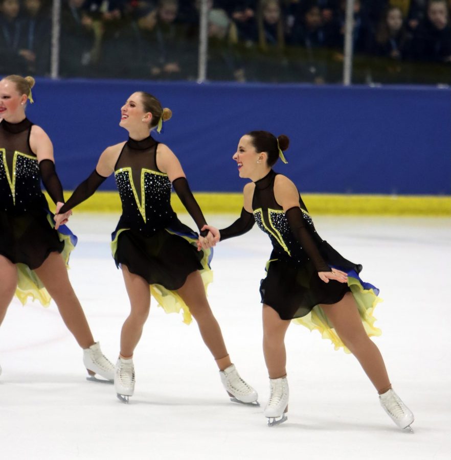 Reynolds skates in sync with her teammates.