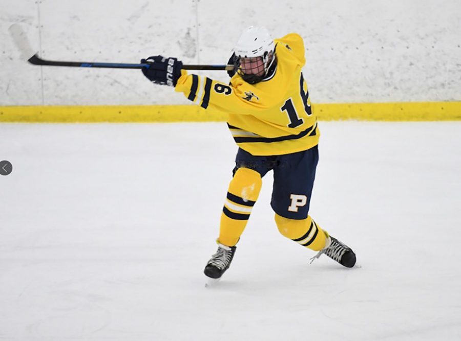 Senior Nic Shotkoski fires the puck towards the net.