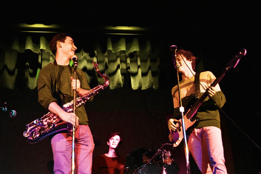 Seniors Stephen Tabhaz and Lance Brady, and junior Jack Dennison jam out during their 
Battle of the Bands performance.