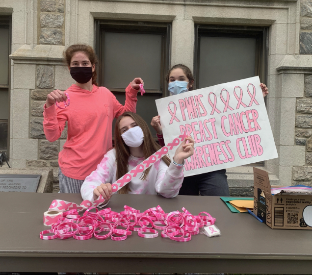 Members of the Breast Cancer Awareness Club fundraise money by selling bracelets, stickers, and tattoos.