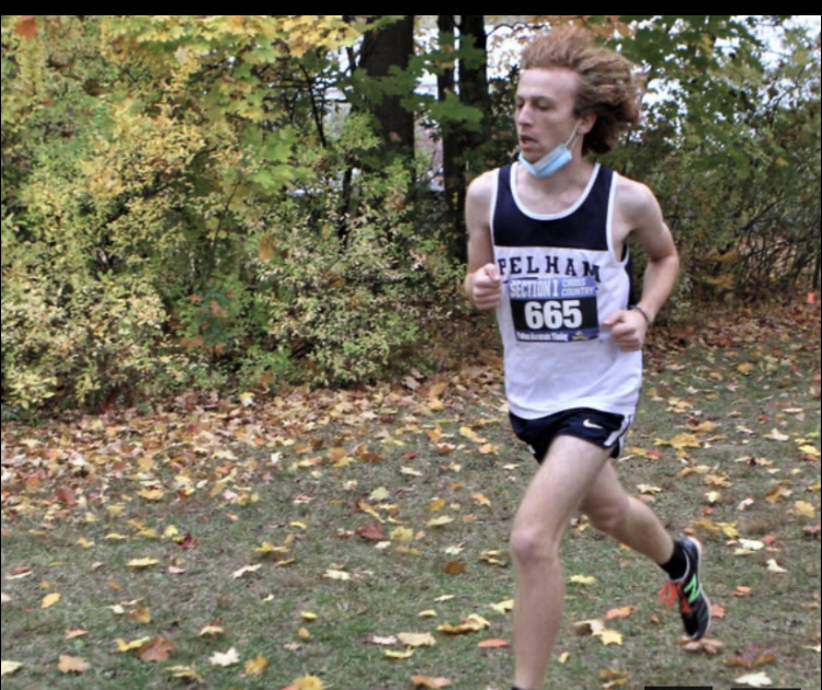 Junior Ben Levine races through the cross country course.