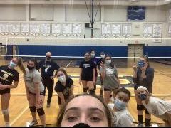 The girls varsity Volleyball team get ready to start play at an open gym session.