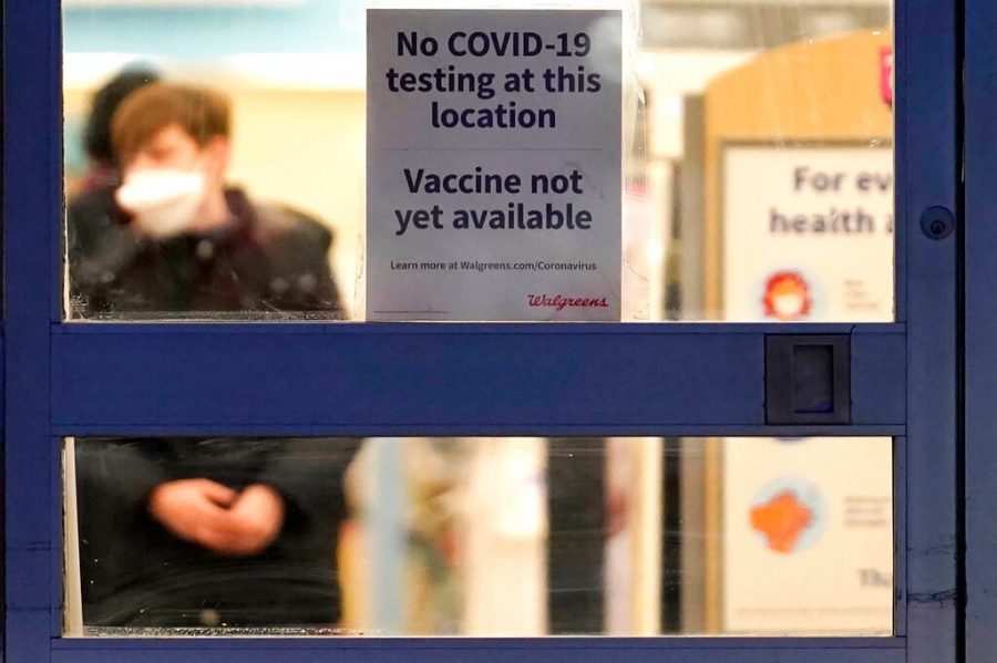FILE - In this Jan. 16, 2021, file photo, a sign saying that a COVID-19 vaccine is not yet available hangs at Walgreens in Glenview, Ill. Smaller-than-expected vaccine deliveries from the federal government have caused frustration and confusion and limited states ability to attack the outbreak that has killed over 400,000 Americans.(AP Photo/Nam Y. Huh, File)