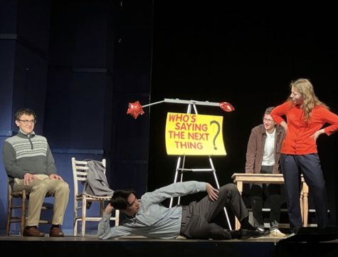 In the play “Comic Inc.,” senior Ethan Luce (seated) gets a lesson in humor.