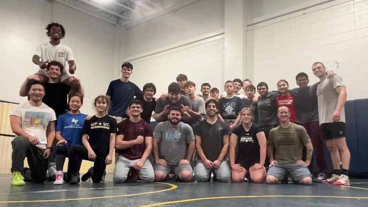 The Pelham-Eastchester Wrestling Team with Eastchester alumni
(Photo Courtesy of the Eastchester wrestling Instagram account)